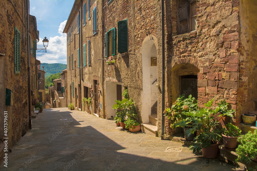 A quiet residential street in the historic centre of the medieval town of Monticiano in Siena Province, Tuscany, Italy
A quiet residential street in the historic centre of the medieval town of Monticiano in Siena Province, Tuscany, Italy