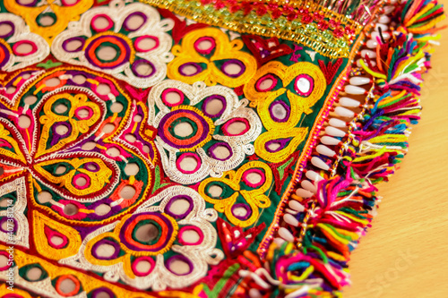 art embroidery,decorations kutch art,beautiful view of embroidery,colorful ahir bharat,embroidered handicrafts close-up,selective focus,rajasthan embroidery flower and pattern art © Dinesh