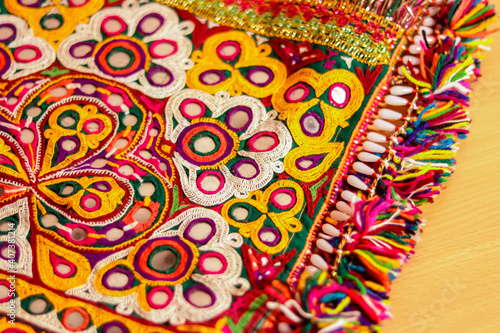 art embroidery,decorations kutch art,beautiful view of embroidery,colorful ahir bharat,embroidered handicrafts close-up,selective focus,rajasthan embroidery flower and pattern art photo