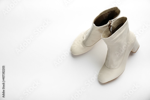 Pair of stylish leather shoes on white background, above view