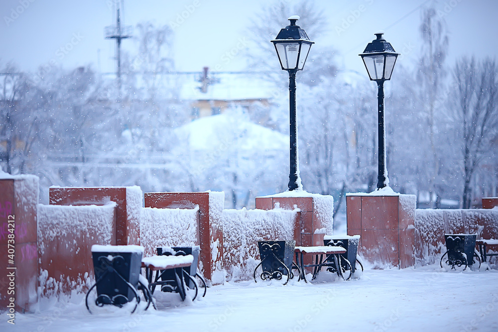Naklejka premium landscape bench in city park winter frost, christmas morning in the city