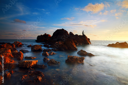 Beautiful sunset on tropical beach with rocks at Chanthaburi province, Thailand