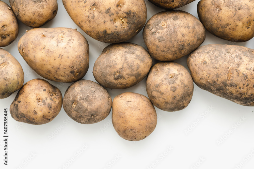 potatoes on white background, dirty potatoes, a bunch of potatoes potatoes on white background, dirty potatoes, a bunch of potatoes