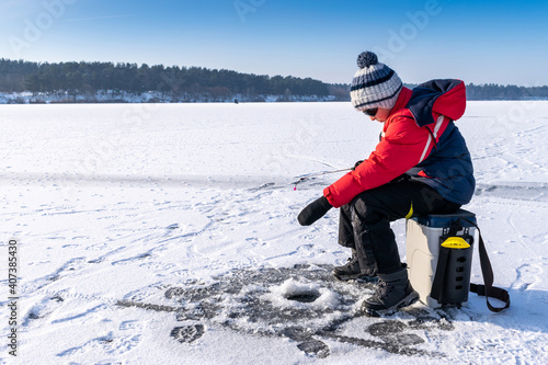 Boy enjoys winter fishing