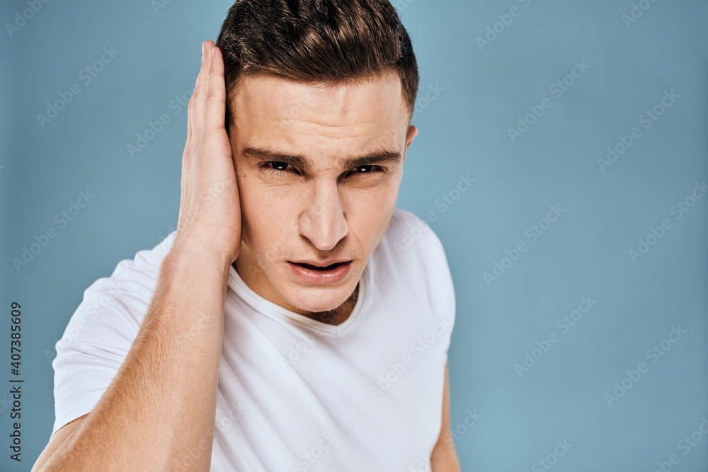 emotional displeased man cropped view white t-shirt blue background emotional displeased man cropped view white t-shirt blue background