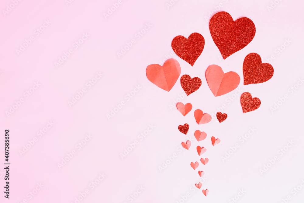 Flying heart shaped paper element on pink background. symbol of love for Happy Women's, Mother, Valentine's Day, birthday greeting card designs with copy space