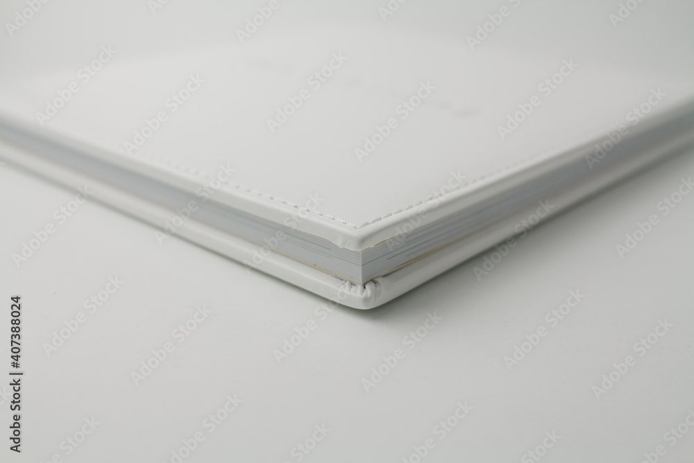 white wedding photo book from white leather on white background