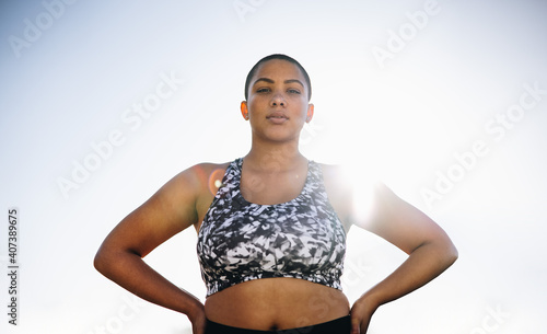 Photos Confident plus size female model in sportswear