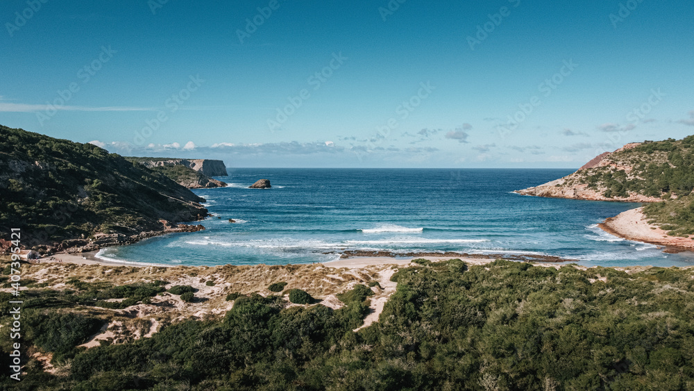 Paradise Island of Menorca at Cala Algaiarens Beach with turquoise colour mediterranean sea. 