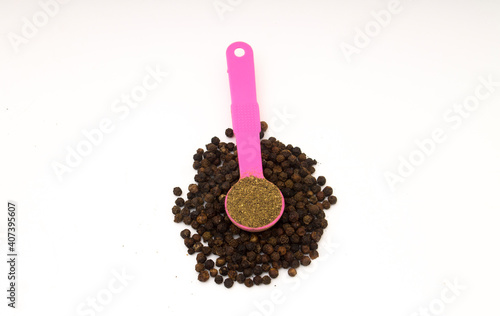 black peppercorns and powder  photo