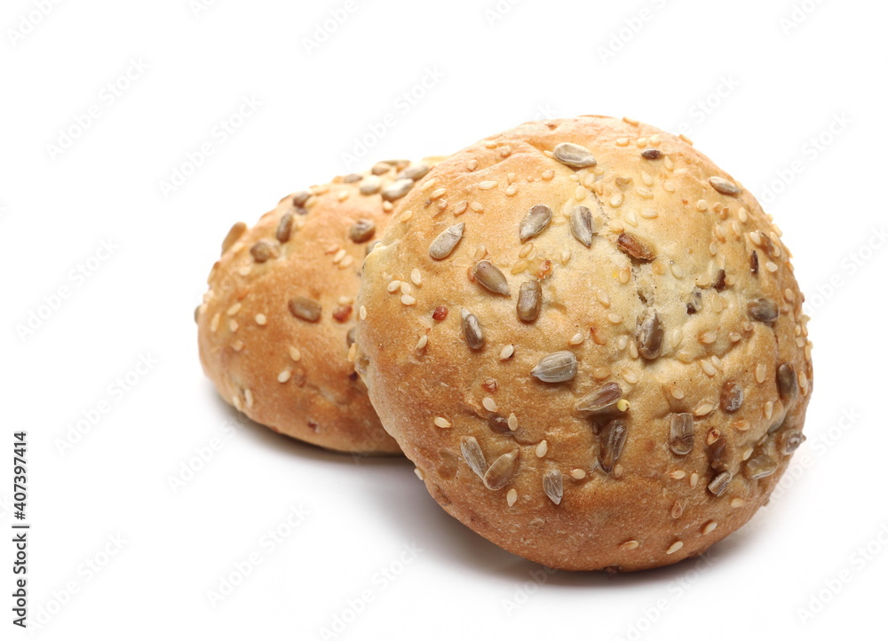 Round bread loafs, buns with mixed seeds isolated on white background Round bread loafs, buns with mixed seeds isolated on white background