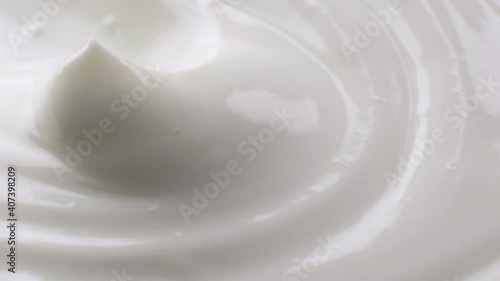 Sour cream with spoon, fresh greek yogurt close up photo