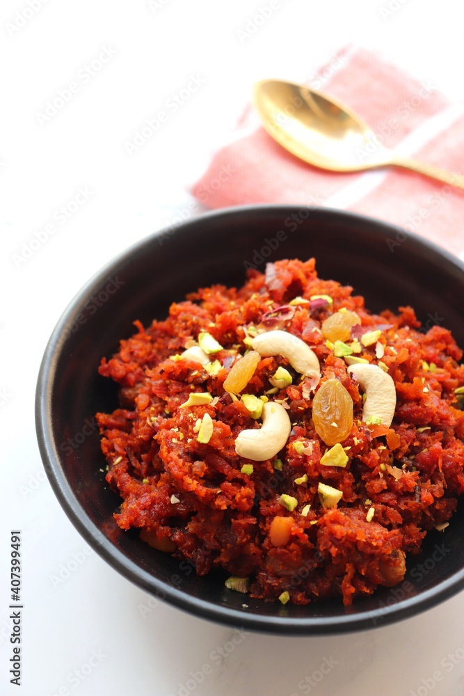 Gajar Halwa. Indian carrot pudding. It's a sweet dessert made from carrots, sugar, and cream. Garnished with cashew, almond, Raisin, and pistachio.