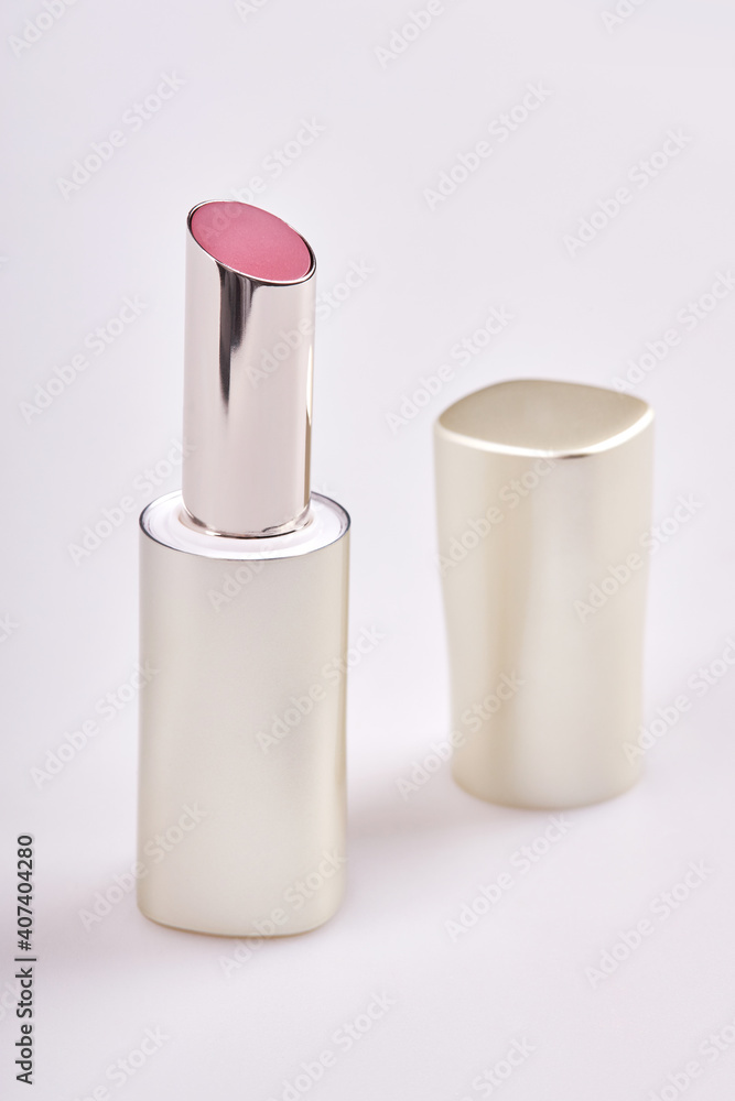Beautiful pink lipstick in the matt container isolated on white background
Beautiful pink lipstick in the matt container isolated on white background