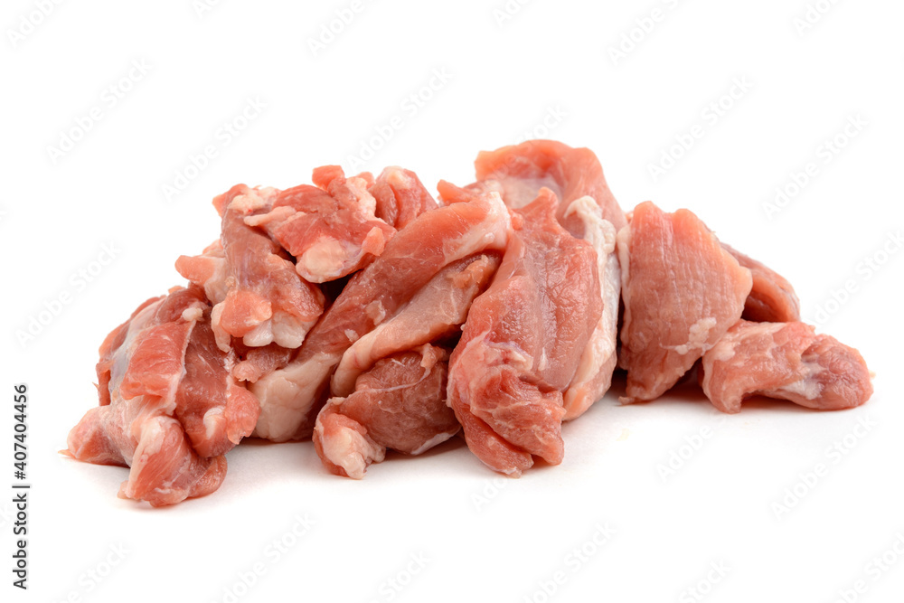 Raw pork meat cut into pieces, isolated on a white background. Raw pork meat cut into pieces, isolated on a white background.