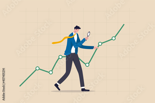 Stock market data analysis, financial research professional or investment and economic forecast concept, smart businessman analyst using magnifying glass look in details on market data rising graph.