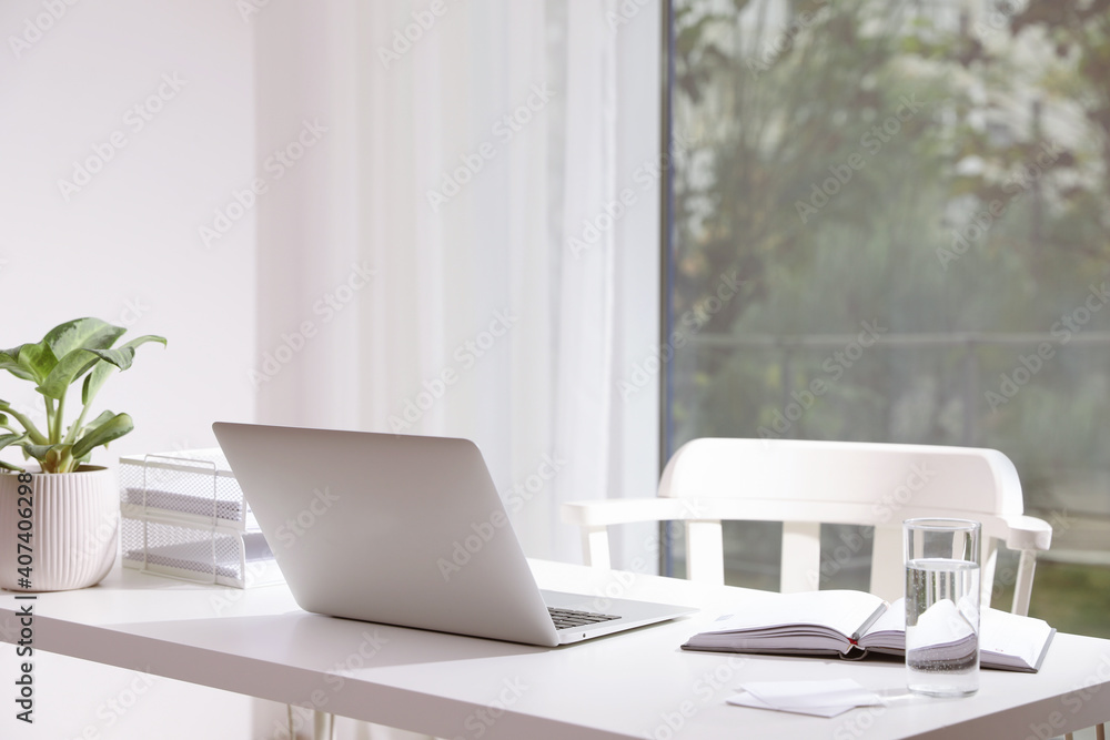 Fototapeta premium Comfortable workplace with modern laptop in office