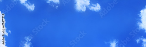 long blue sky with clouds. background for inscriptions high up