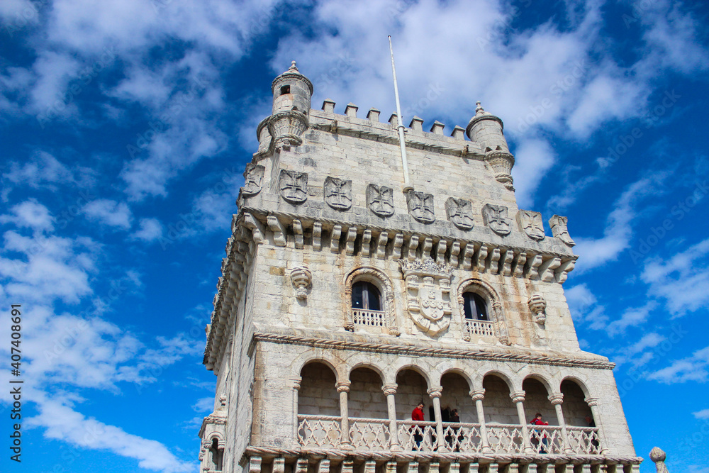 Low angle view of Belém Tower against blue sky in Lisbon, Portugal