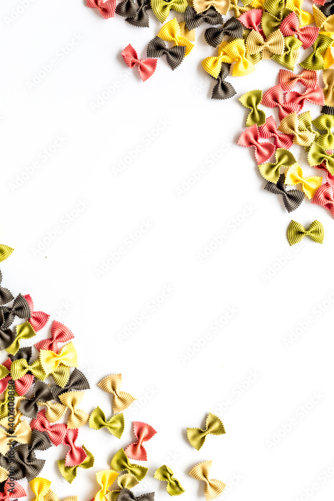 Frame of pasta - flay lay of Italian colorful farfalle, top view Frame of pasta - flay lay of Italian colorful farfalle, top view