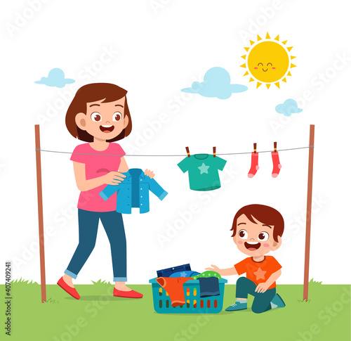 little kid helping mother to dry the clothes outside