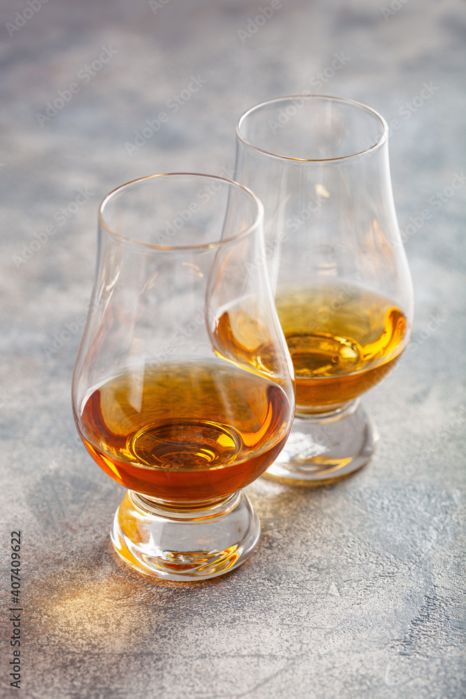 glass of whisky spirit brandy on gray concrete background glass of whisky spirit brandy on gray concrete background