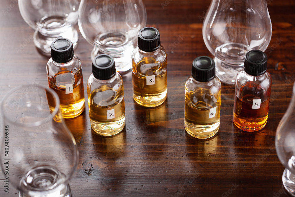 tasting bottles and glasses of whisky spirit brandy cognac. tasting at home tasting bottles and glasses of whisky spirit brandy cognac. tasting at home