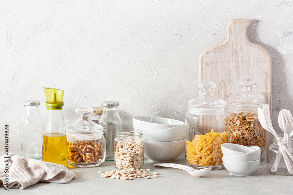 kitchen utensils on modern simple counter, kitchenware jars with dry ingredients bowls kitchen utensils on modern simple counter, kitchenware jars with dry ingredients bowls