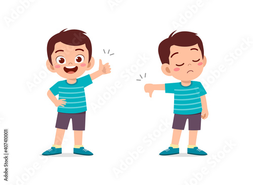 little boy show hand gesture thumb up and thumb down