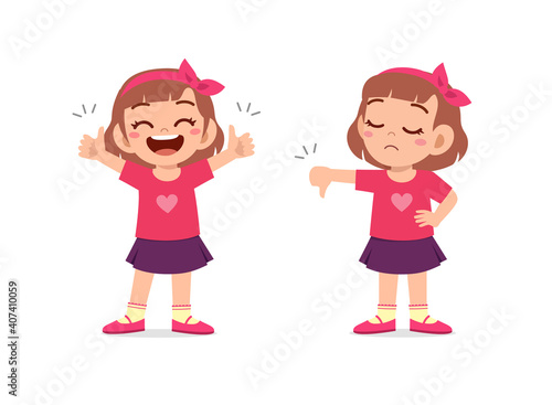 little girl show hand gesture thumb up and thumb down