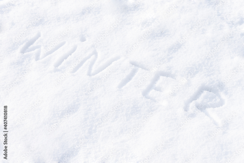 Winter word written on snow. Winter season concept