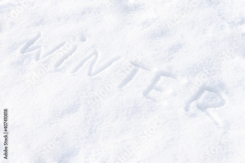 Winter word written on snow. Winter season concept