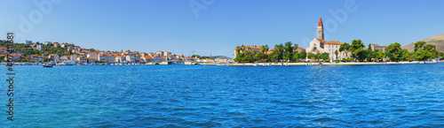 Sailing boat anchoring in Trogir town with historic buildings in background, Dalmatia, Croatia © Igor