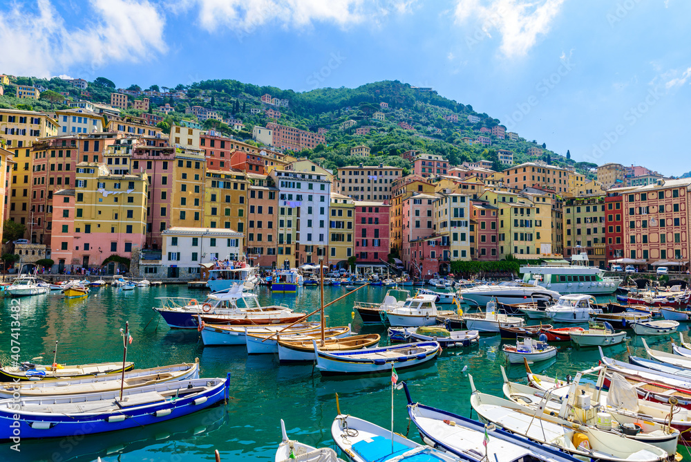 Camogli town in Liguria, Italy. Scenic Mediterranean riviera coast. Historical Old Town Camogli with colorful houses and sand beach at beautiful coast of Italy.