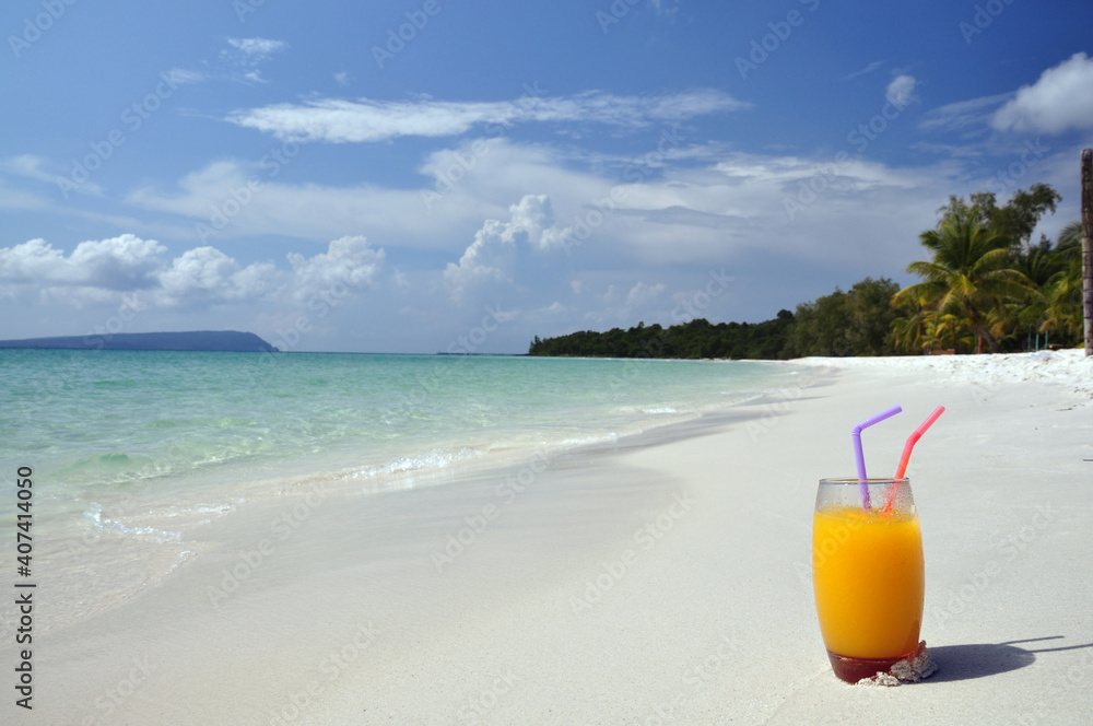 Glass of mango juice on a tropical beach. Cambodia ,