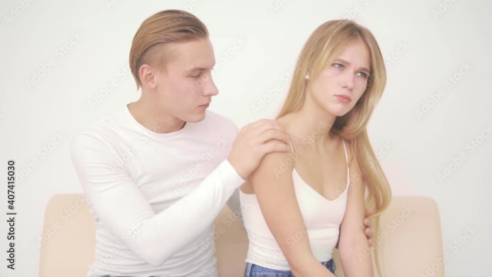 A young man calms the offended girlfriend A young man calms the offended girlfriend