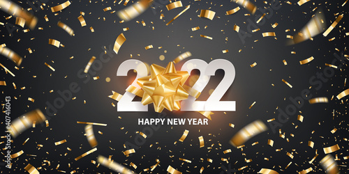 Happy new year 2022. Golden self adhesive gift bow with white number and confetti, against black background. Holiday greeting card. Vector illustration.