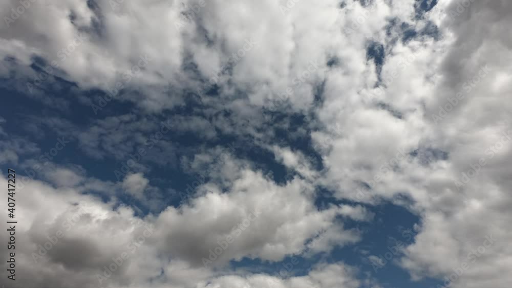 Large cumulus clouds in the blue summer sky. Timelapse. Cloudy sky as background.
Large cumulus clouds in the blue summer sky. Timelapse. Cloudy sky as background.