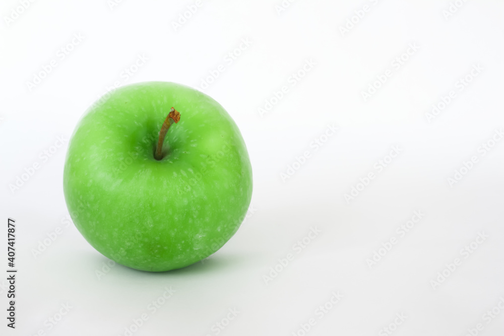 Fresh green apple isolated on white background with space for text. Healthy foods or snack. Fresh green apple isolated on white background with space for text. Healthy foods or snack.
