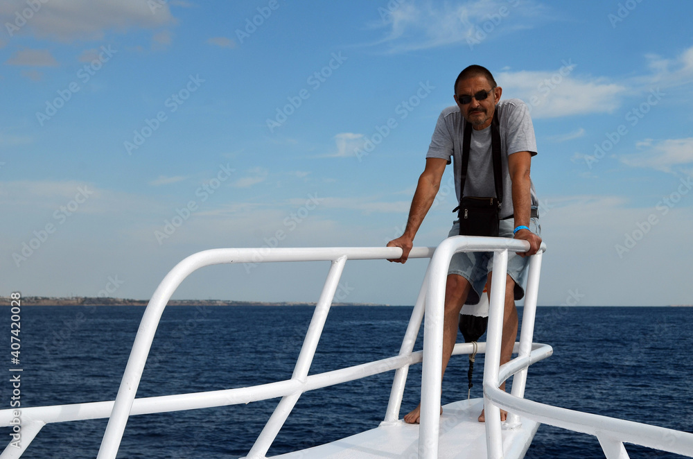 Tourist from Kiev on divers boat. Red Sea, Sharm El Sheikh, Egypt Tourist from Kiev on divers boat. Red Sea, Sharm El Sheikh, Egypt