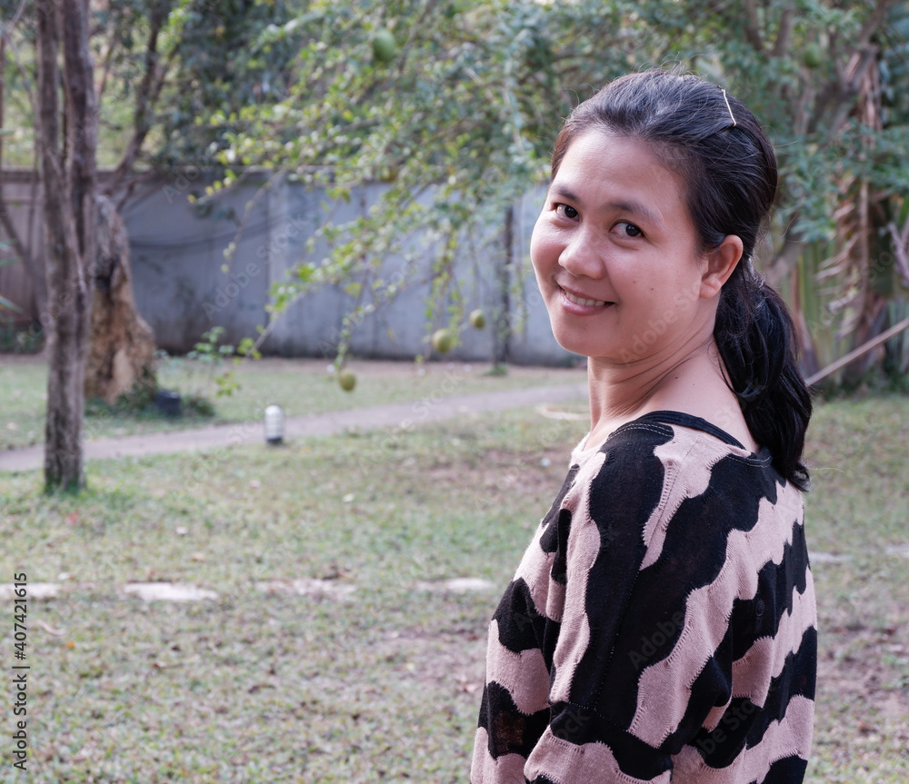 portrait of beautiful woman smiling in the Garden portrait of beautiful woman smiling in the Garden