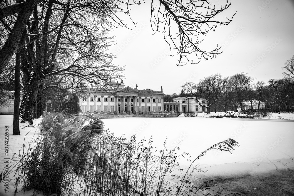  historic palace on the water in Łazienki Królewskie park in Warsaw, Poland during snowy winter