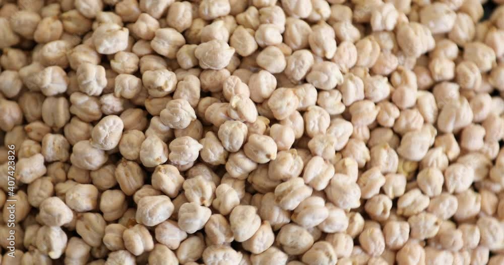 Close up view of uncooked organic chickpea rotating Close up view of uncooked organic chickpea rotating