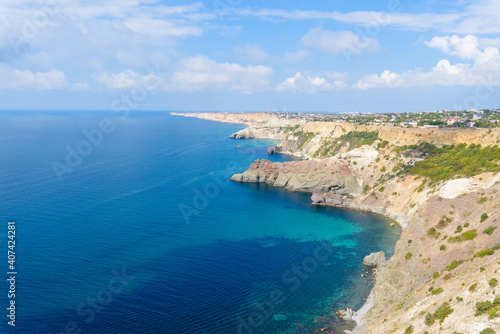 panorama of the sea mountain coast  Crimea the Black Sea coast on a sunny day . rocks on the shore  blue sky