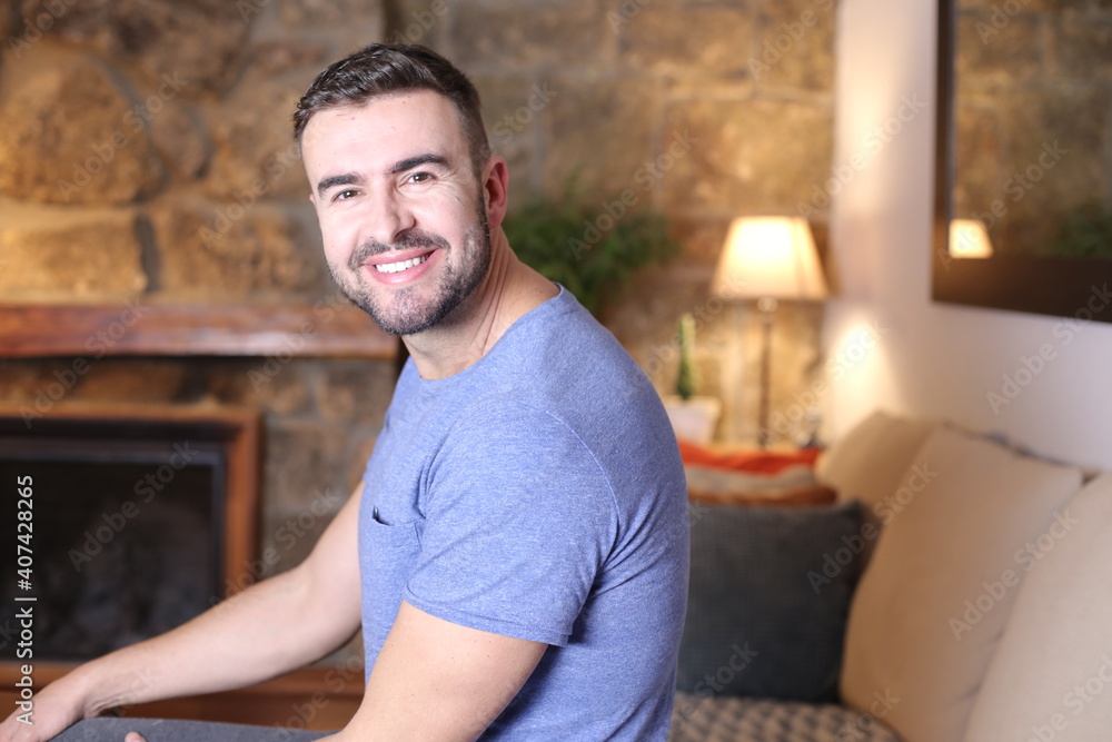 Handsome man smiling at home Handsome man smiling at home