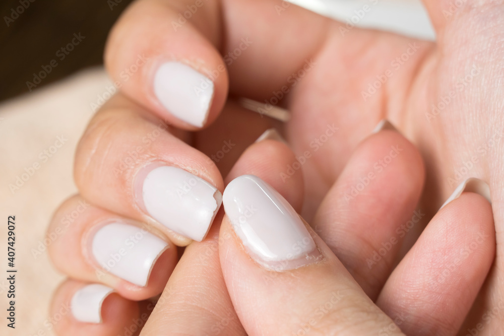 An old manicure. Overgrown nail polish. Manicure correction. Nail care. Beauty salon, SPA, procedure. Manicure. Home nail care. Manicure tools. Beauty, lifestyle. Nude nail polish, classic manicure. An old manicure. Overgrown nail polish. Manicure correction. Nail care. Beauty salon, SPA, procedure. Manicure. Home nail care. Manicure tools. Beauty, lifestyle. Nude nail polish, classic manicure.