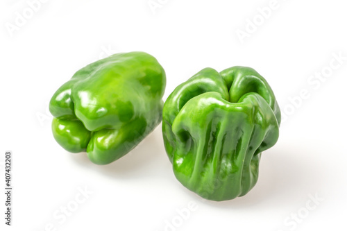 Fresh green bell peppers on a white background
