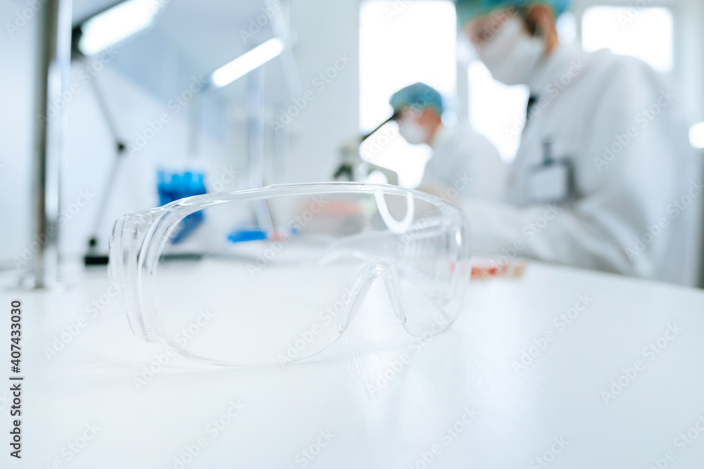 background image of scientists working in a scientific laboratory . background image of scientists working in a scientific laboratory .