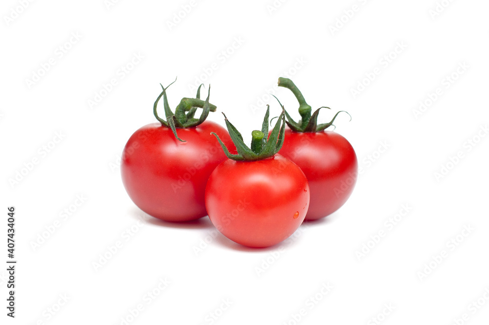 Three red tomatoes on a white background Three red tomatoes on a white background