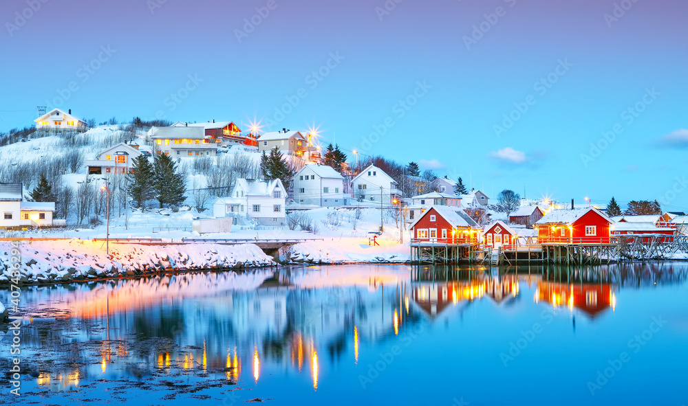Naklejka premium Dramatic evening cityscape of Reine town